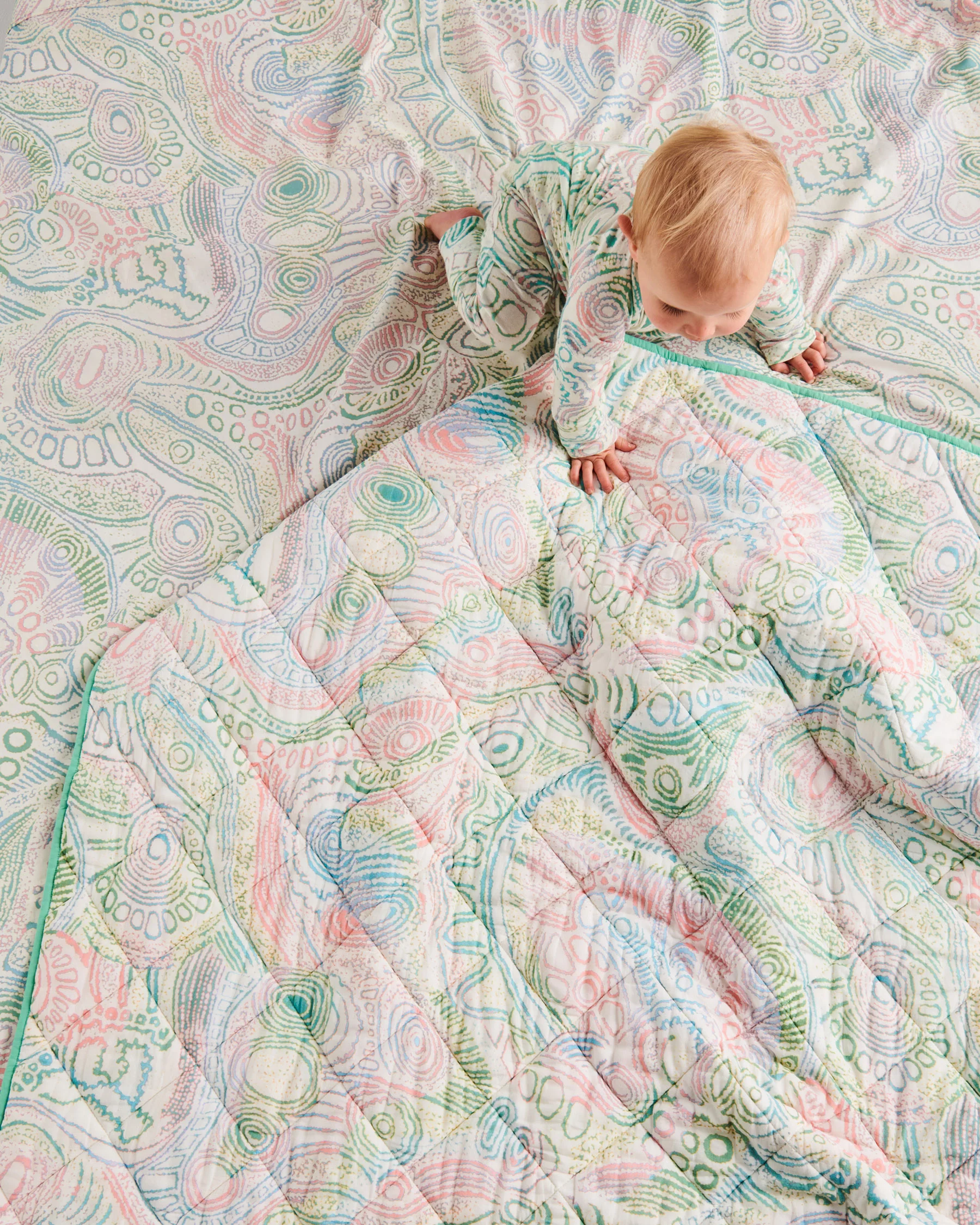 Tjala Tjukurpa Pastel Organic Cotton Quilted Cot Bedspread - Image 3